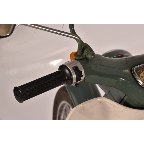 311 - A 1965 Honda C50 50cc moped, registration: EMO 61C, in green, with windshield and rear rack with pan... 