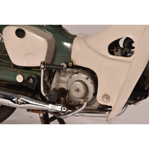 311 - A 1965 Honda C50 50cc moped, registration: EMO 61C, in green, with windshield and rear rack with pan... 