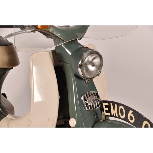 311 - A 1965 Honda C50 50cc moped, registration: EMO 61C, in green, with windshield and rear rack with pan... 