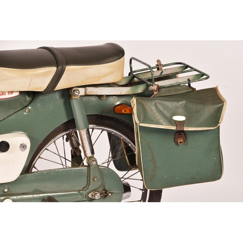 311 - A 1965 Honda C50 50cc moped, registration: EMO 61C, in green, with windshield and rear rack with pan... 