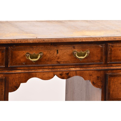 292 - An early 20th century walnut pedestal desk, the tooled brown leather top, over three frieze drawers,... 