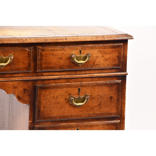 292 - An early 20th century walnut pedestal desk, the tooled brown leather top, over three frieze drawers,... 