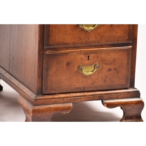 292 - An early 20th century walnut pedestal desk, the tooled brown leather top, over three frieze drawers,... 