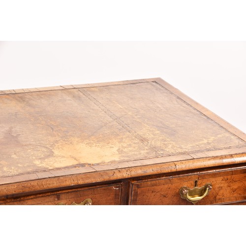 292 - An early 20th century walnut pedestal desk, the tooled brown leather top, over three frieze drawers,... 