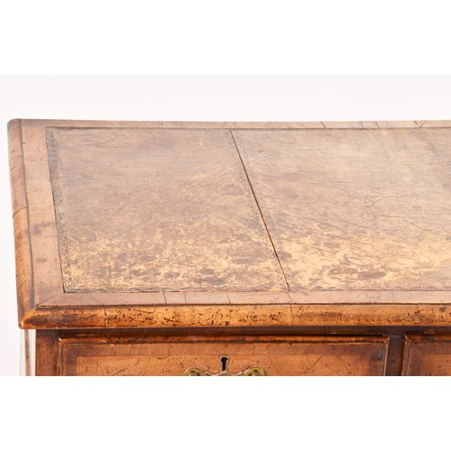 292 - An early 20th century walnut pedestal desk, the tooled brown leather top, over three frieze drawers,... 