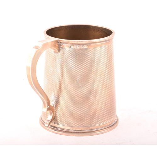 180 - A Victorian silver tankard, hallmarked London 1869 by Goldsmiths Alliance Ltd, 11cm high.