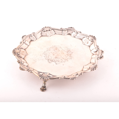 183 - A George III footed silver salver, ornate shell rim, engraved detail to surface, hallmarked for Lond... 