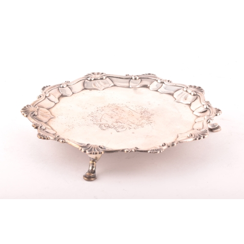 183 - A George III footed silver salver, ornate shell rim, engraved detail to surface, hallmarked for Lond... 