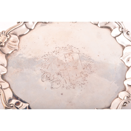 183 - A George III footed silver salver, ornate shell rim, engraved detail to surface, hallmarked for Lond... 