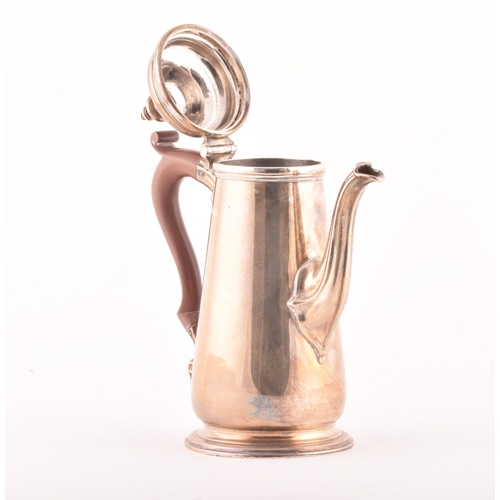 185 - A George V silver coffee pot, of tapering cylindrical form with wooden handle, hallmarked Chester 19... 