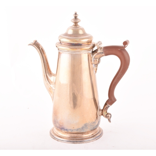 185 - A George V silver coffee pot, of tapering cylindrical form with wooden handle, hallmarked Chester 19... 