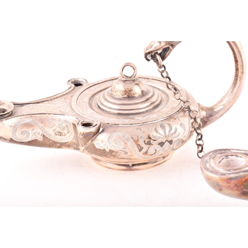 186 - A Victorian silver cigar lighter in the form of an oil lamp, one silver with ornate engraved decorat... 