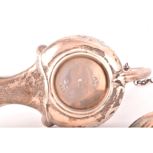 186 - A Victorian silver cigar lighter in the form of an oil lamp, one silver with ornate engraved decorat... 