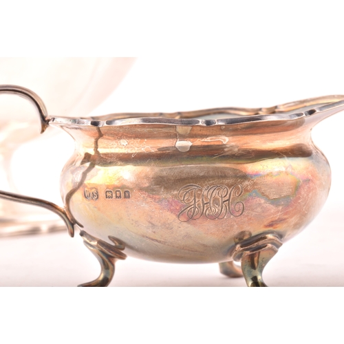 188 - A George III silver cream jug hallmarked London 1778, a George III sugar bowl hallmarked for London ... 