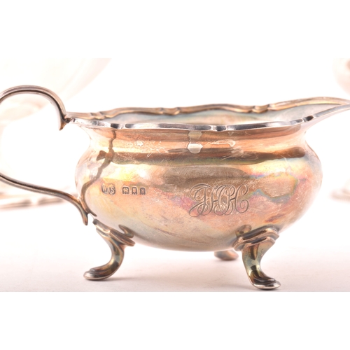 188 - A George III silver cream jug hallmarked London 1778, a George III sugar bowl hallmarked for London ... 