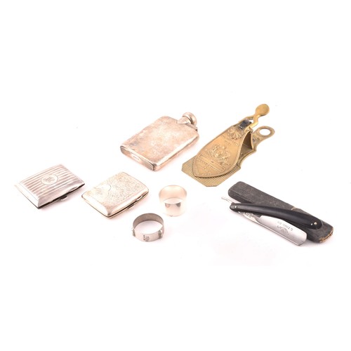 191 - A collection of silver items, including two Victorian napkin rings, two cigarette cases, one hallmar... 