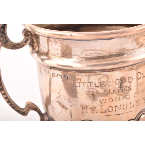 192 - A collection of silver items, including a George V silver trophy cup, hallmarked for Birmingham 1932... 