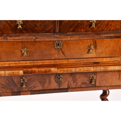 274 - An early 18th century William and Mary figured walnut chest on stand, the top with a pair of doors w... 