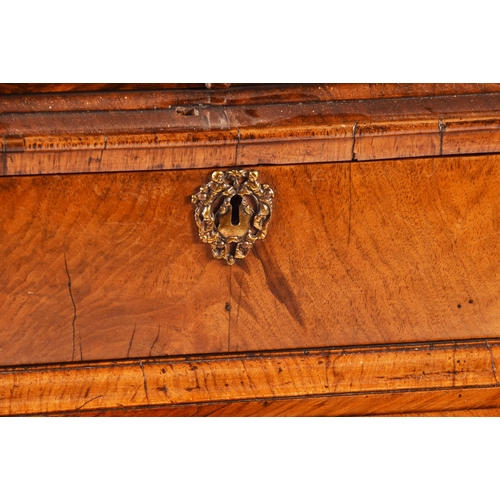 274 - An early 18th century William and Mary figured walnut chest on stand, the top with a pair of doors w... 