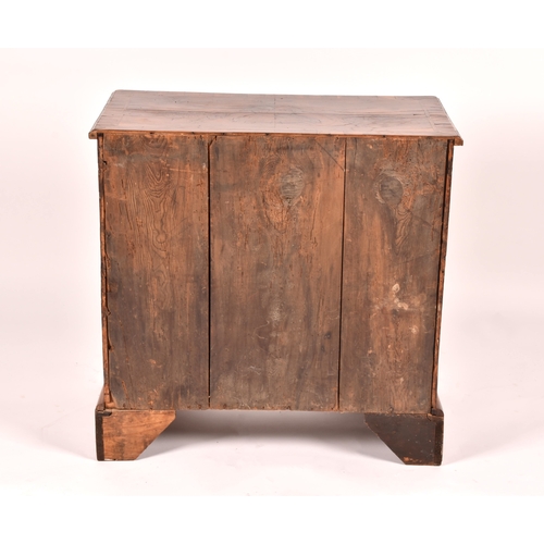 294 - An early 18th century walnut kneehole desk, the oyster veneered walnut cross banded top over a friez... 