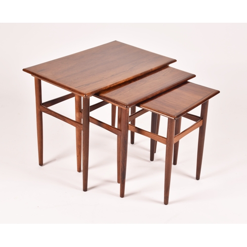 295 - A Danish Dyrlund rosewood nest of three tables, the crossbanded tops with moulded edges and supporte... 