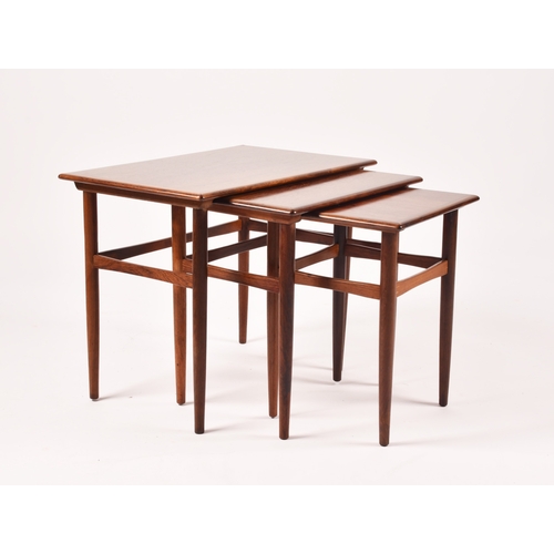 295 - A Danish Dyrlund rosewood nest of three tables, the crossbanded tops with moulded edges and supporte... 