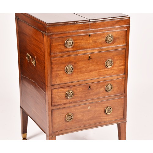 297 - A George III mahogany dressing chest, the top with a pair of flaps opening to reveal a fitted interi... 