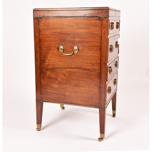 297 - A George III mahogany dressing chest, the top with a pair of flaps opening to reveal a fitted interi... 