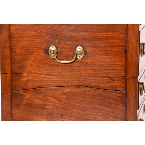 297 - A George III mahogany dressing chest, the top with a pair of flaps opening to reveal a fitted interi... 