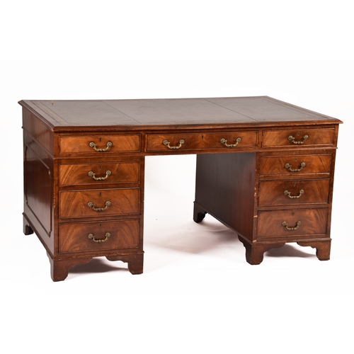 299 - A large mahogany pedestal desk, the green gilt tooled leather top over three frieze drawers, wit thr... 