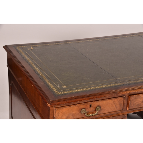 299 - A large mahogany pedestal desk, the green gilt tooled leather top over three frieze drawers, wit thr... 