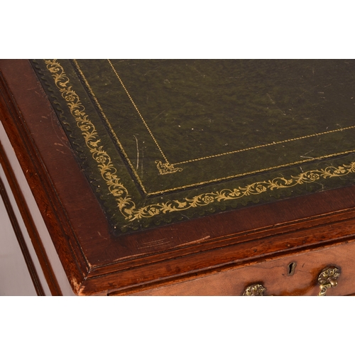 299 - A large mahogany pedestal desk, the green gilt tooled leather top over three frieze drawers, wit thr... 