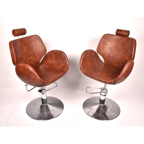 301 - A pair of Chloe tan leather styling / barber chairs, height adjustable, each with scallop shaped sea... 