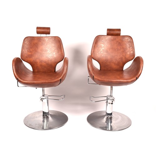 301 - A pair of Chloe tan leather styling / barber chairs, height adjustable, each with scallop shaped sea... 