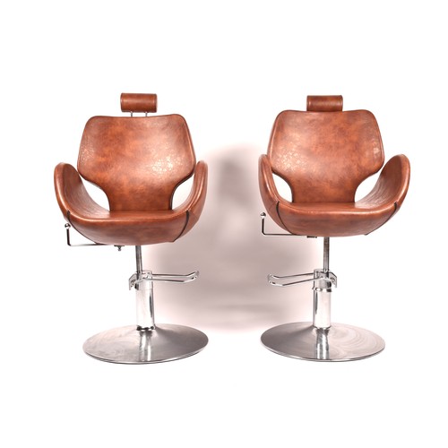 301 - A pair of Chloe tan leather styling / barber chairs, height adjustable, each with scallop shaped sea... 