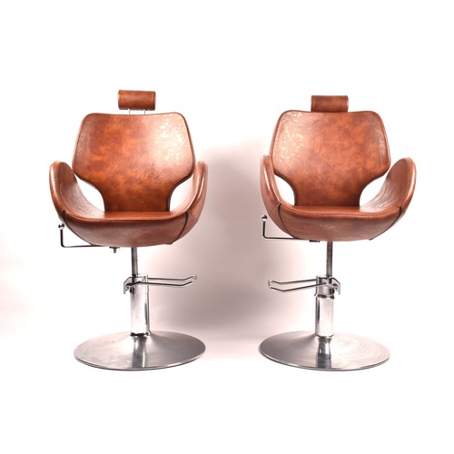 301 - A pair of Chloe tan leather styling / barber chairs, height adjustable, each with scallop shaped sea... 