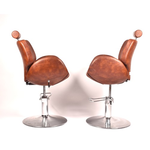 301 - A pair of Chloe tan leather styling / barber chairs, height adjustable, each with scallop shaped sea... 