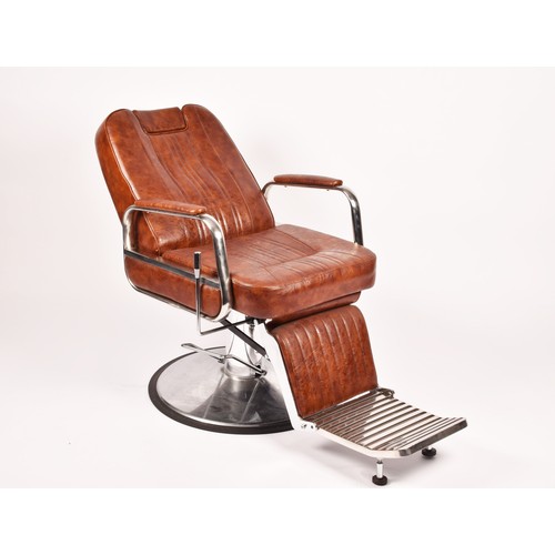 302 - A Nicholas tan leather barber chair, height adjustable, with reclining back and head rest, supported... 