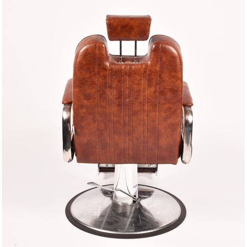 302 - A Nicholas tan leather barber chair, height adjustable, with reclining back and head rest, supported... 