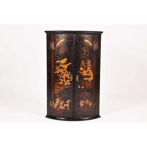 309 - An 18th century Chinoiserie decorated bow fronted corner cupboard, the pair of doors decorated with ... 