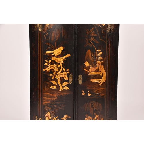 309 - An 18th century Chinoiserie decorated bow fronted corner cupboard, the pair of doors decorated with ... 