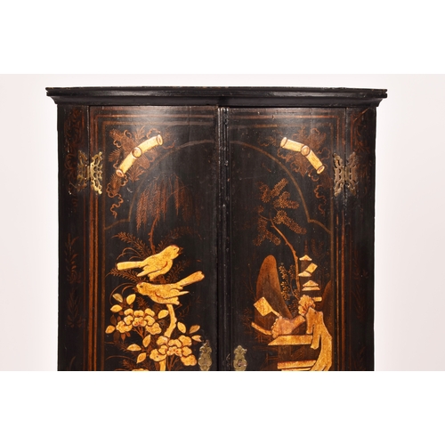 309 - An 18th century Chinoiserie decorated bow fronted corner cupboard, the pair of doors decorated with ... 