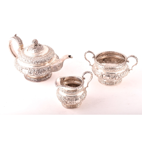 196 - A William IV three-piece Irish silver tea set, including a teapot, 16.5cm height x 29.5cm width, a s... 