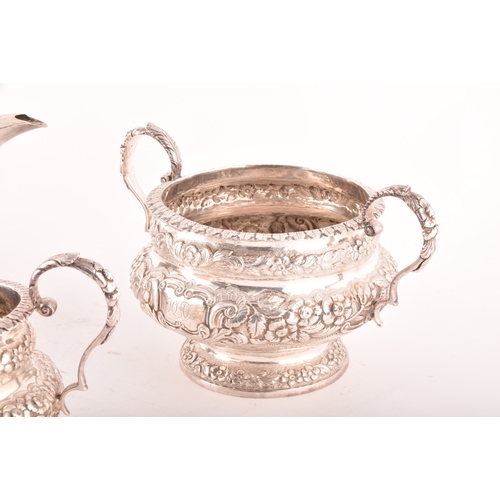 196 - A William IV three-piece Irish silver tea set, including a teapot, 16.5cm height x 29.5cm width, a s... 