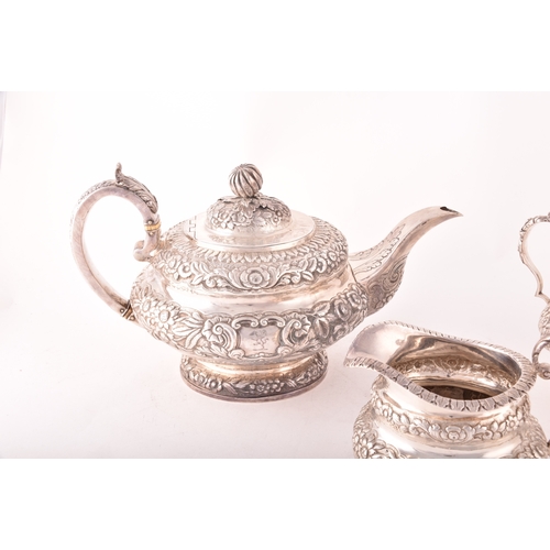 196 - A William IV three-piece Irish silver tea set, including a teapot, 16.5cm height x 29.5cm width, a s... 