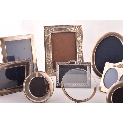 198 - A collection of silver photo frames, including an Art Nouveau style silver frame, with import marks ... 