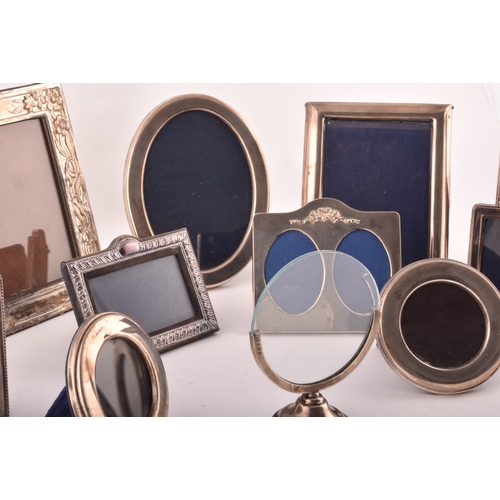 198 - A collection of silver photo frames, including an Art Nouveau style silver frame, with import marks ... 