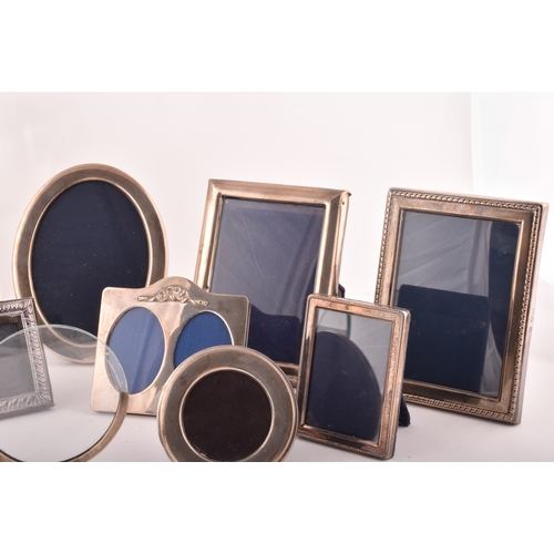 198 - A collection of silver photo frames, including an Art Nouveau style silver frame, with import marks ... 