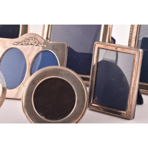 198 - A collection of silver photo frames, including an Art Nouveau style silver frame, with import marks ... 