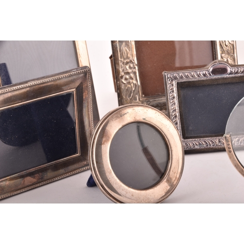 198 - A collection of silver photo frames, including an Art Nouveau style silver frame, with import marks ... 